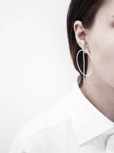 Girl with fancy earring - Ear piercing in Rayleigh is offered at Elan Medical Skin Clinic